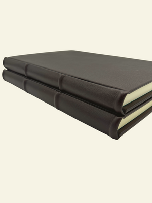 Closeup detail of raised ridges and rounded spine of Epica Guestbooks and Journals