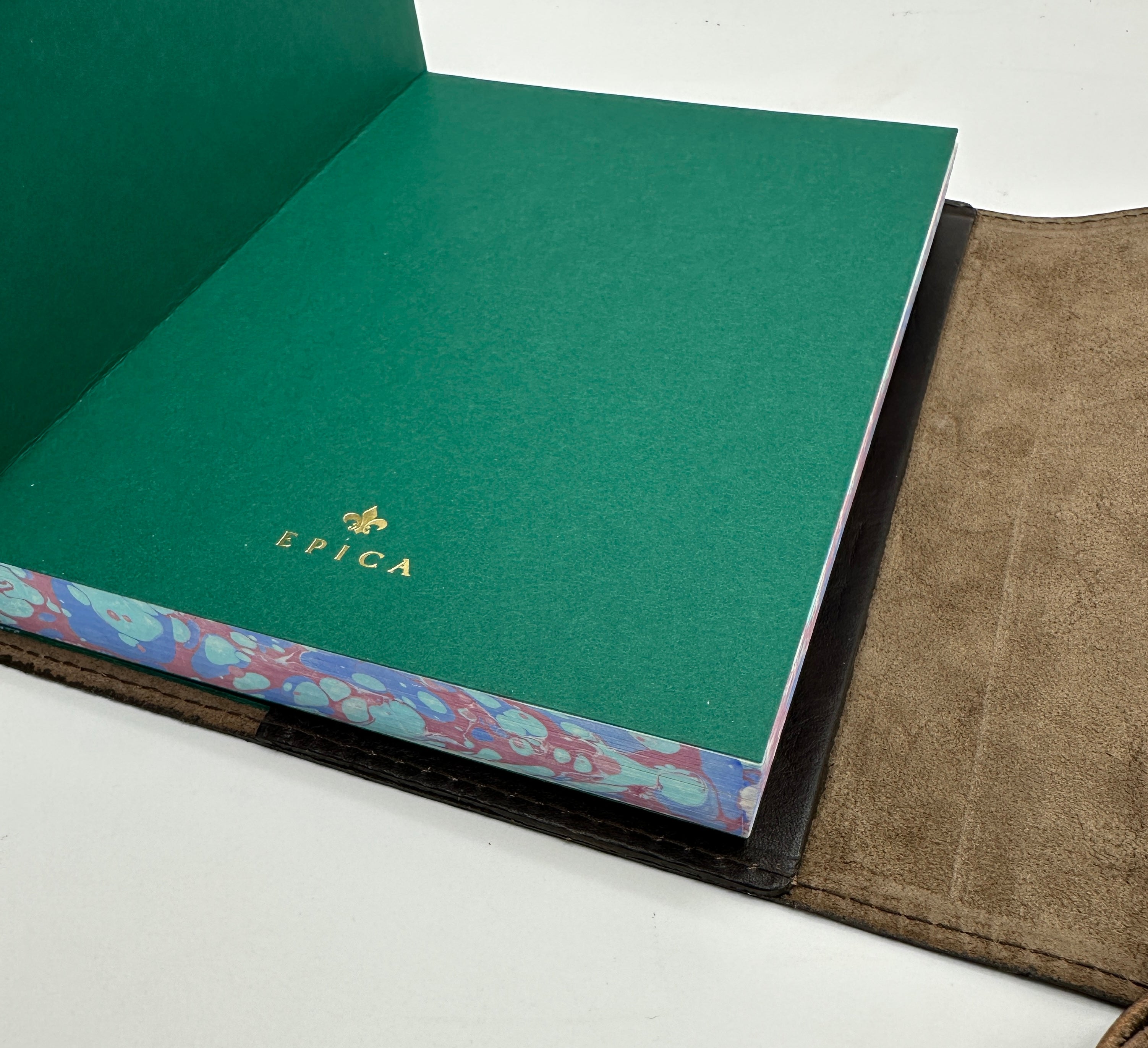 Refillable wrap style leather journal with blue and burgundy marbled edges