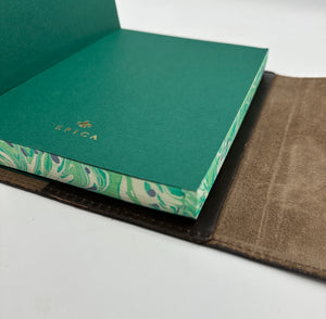 Refillable wrap style leather journal with green and ivory marbled edges