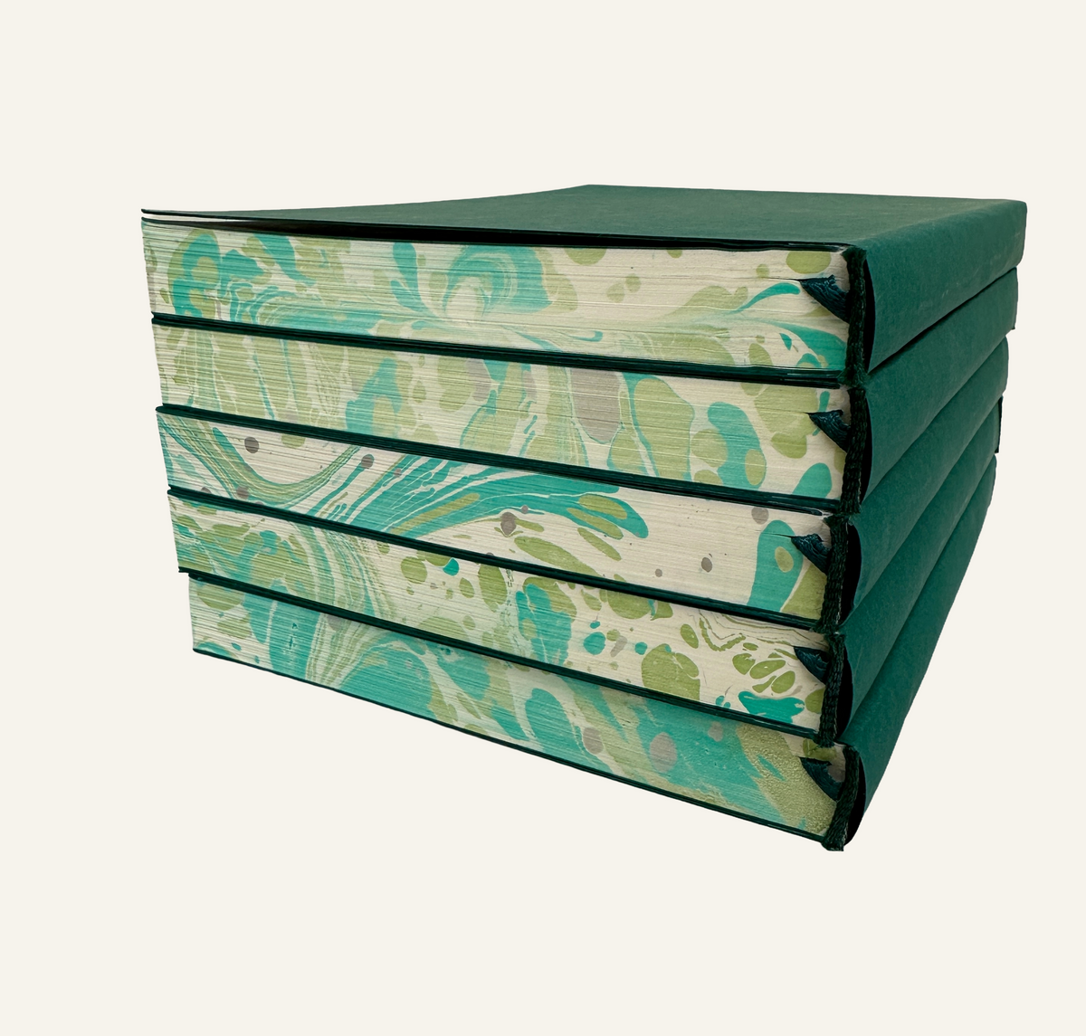 Stacked Marbleized Green and ivory refillable journal inserts with green bookmark
