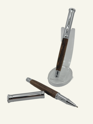Wood barrel rollerball pen with natural wood grain and chrome accents displayed with cap removed to show the writing tip.