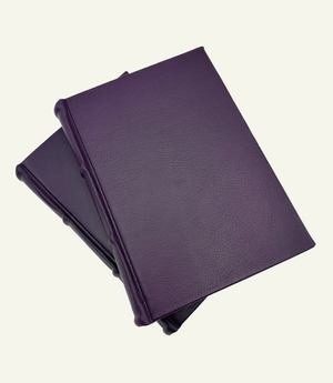 Stacked violet leather Italian journal