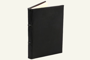 refillable dot-grid journal in black leather