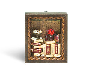 Epica's miniature wooden bookcase diorama