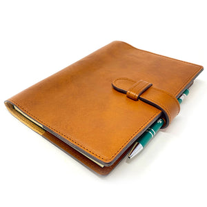 Refillable Italian leather day planner with clasp closure in Saddle Brown