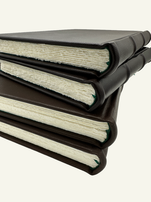 Handcrafted Italian leather journals and guestbooks featuring handmade Amalfi paper and a green ribbon bookmark