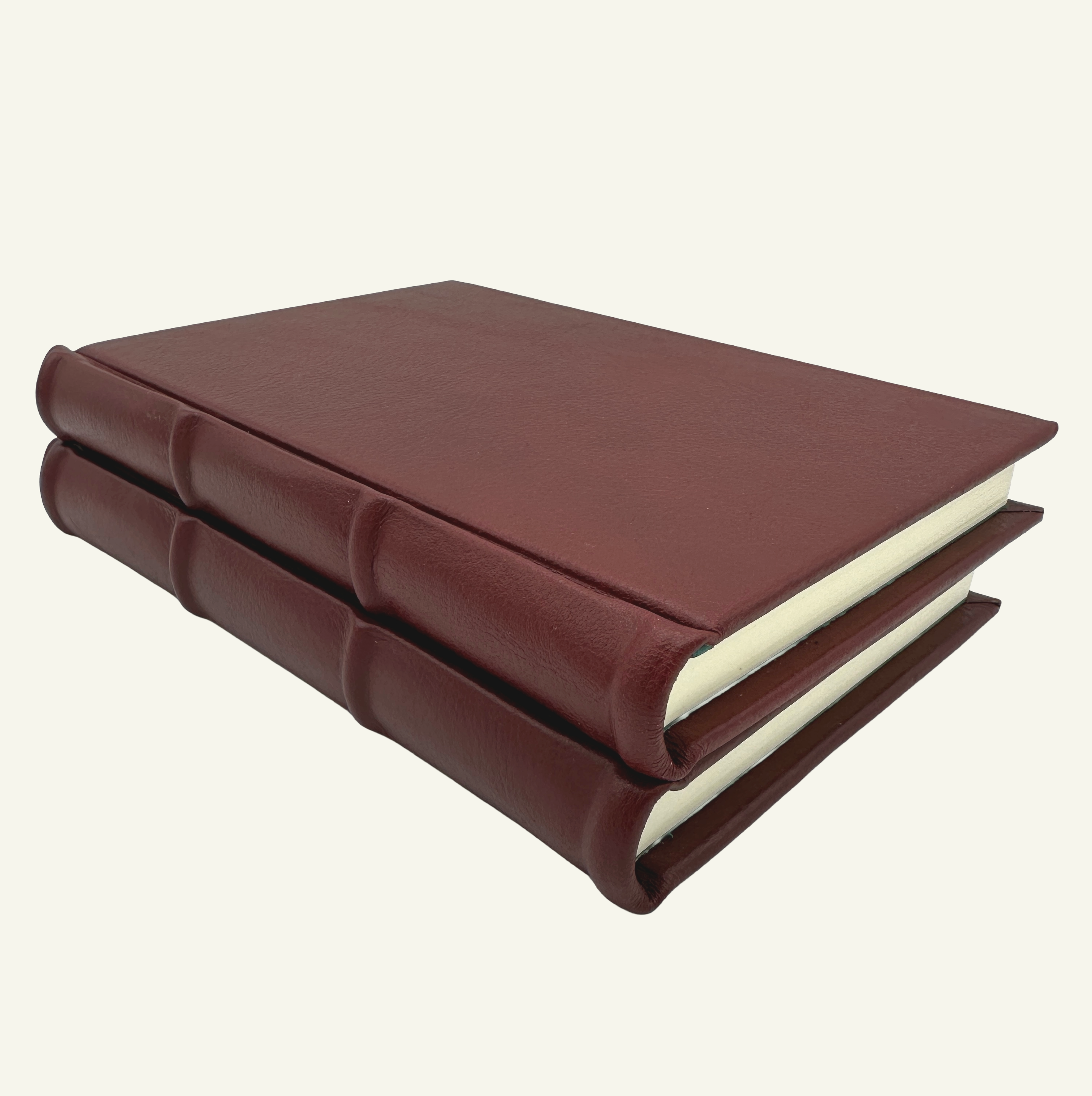 Handmade burgundy leather journal with rounded spine detail 