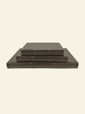 Classic leather journals with raised ridges and rounded spine detail