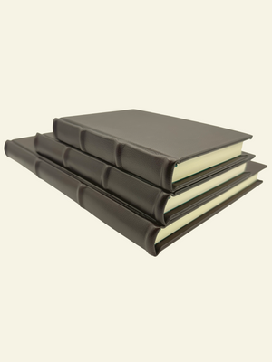 Classic leather journals with raised ridges and rounded spine detail. Available in three sizes