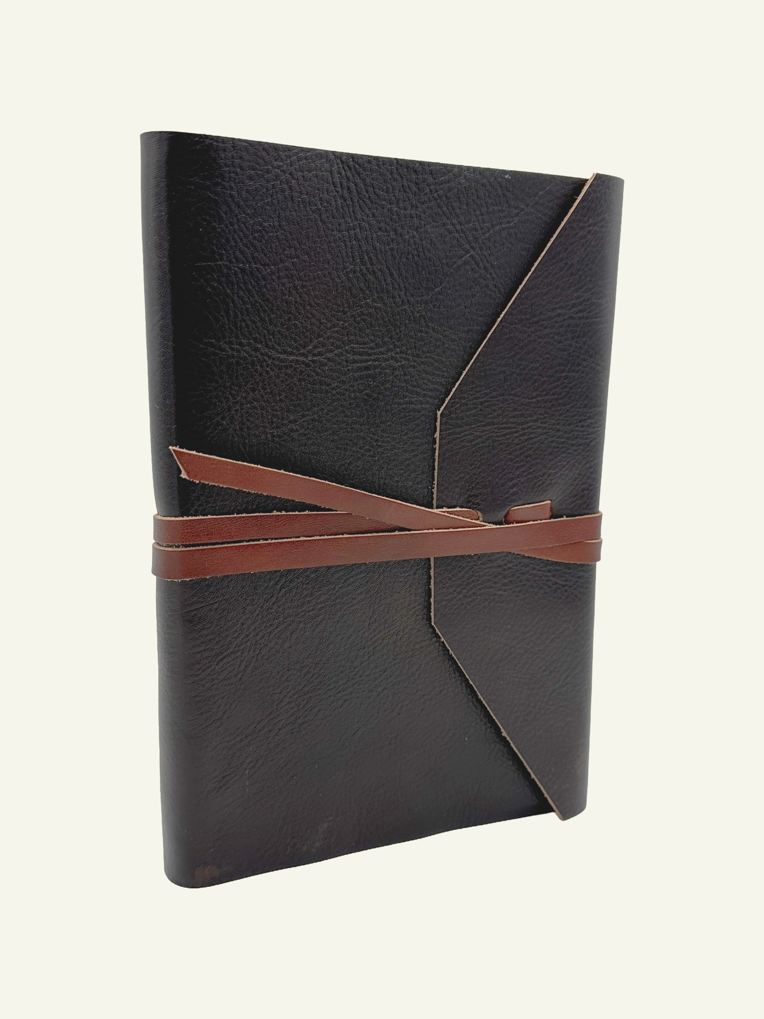 One-of-a-kind handmade Italian leather wrap journal in deep espresso leather with contrasting light brown wrap strap.