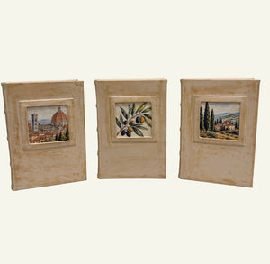 Three distressed sand leather journals featuring Florence, olive branch, and Tuscan village artwork.