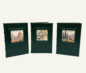 Three Forest Green leather journals with portrait window featuring three designs; Florence Skyline, Italian Olive Branch and Tuscan Village