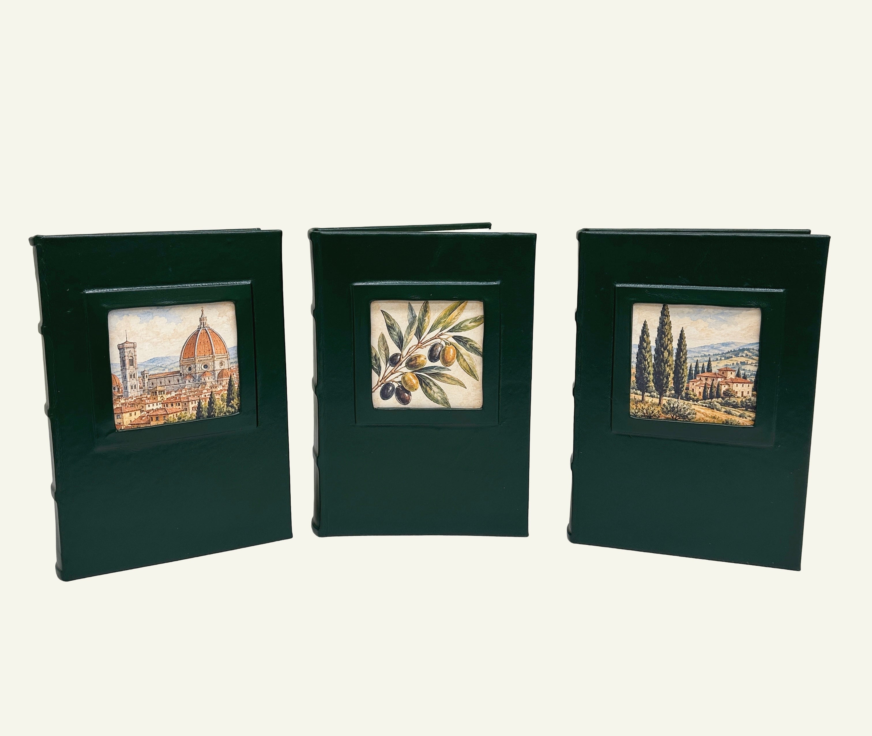 Three Forest Green leather journals with portrait window featuring three designs; Florence Skyline, Italian Olive Branch and Tuscan Village