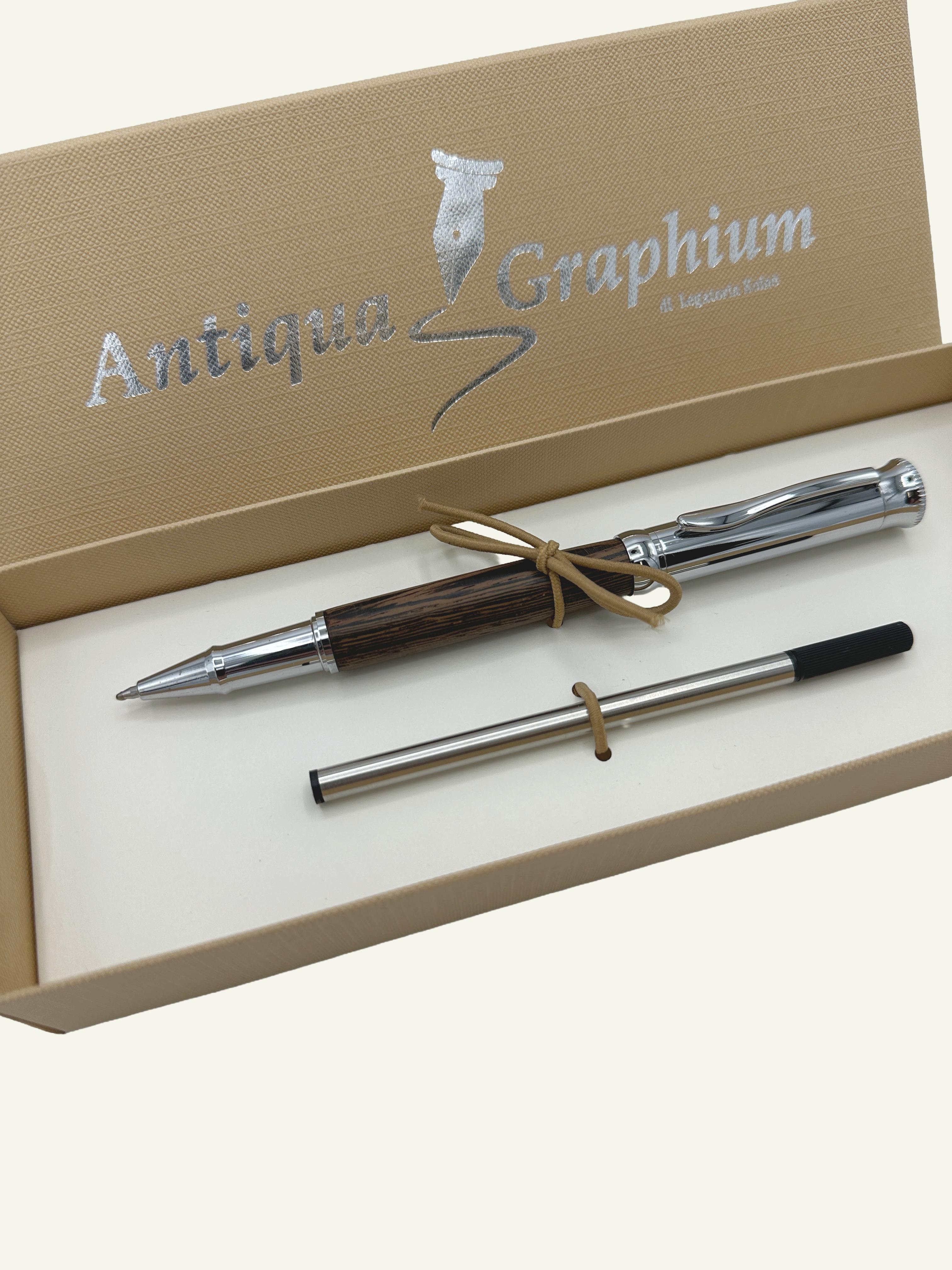 Luxury Italian-made rollerball pen featuring a natural wood barrel, chrome trim, refill and elegant gift box presentation.