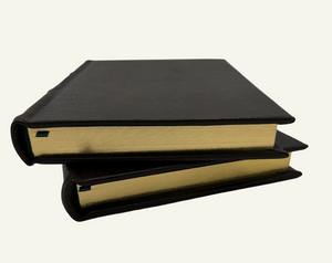 Close up of a handcrafted Italian leather journal featuring gilded gold edges