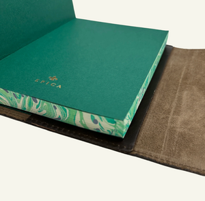 Refillable wrap style leather journal with green and ivory marbled edges