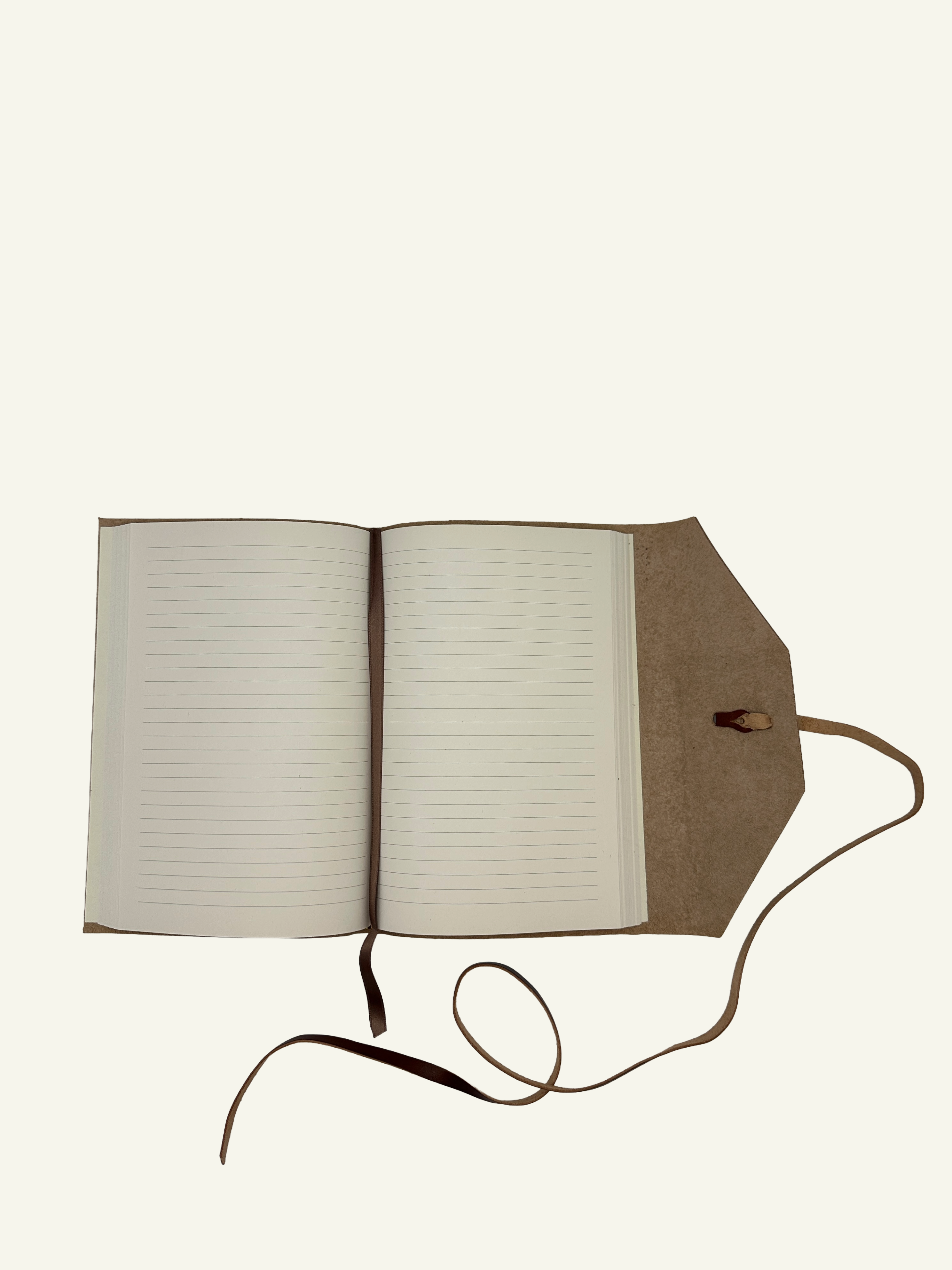 Open handmade Italian leather wrap journal displaying 256 lined writing pages and wrap-style cover.