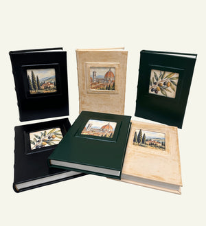 Leather journal collection in black, distressed sand, and forest green with Italian artwork.