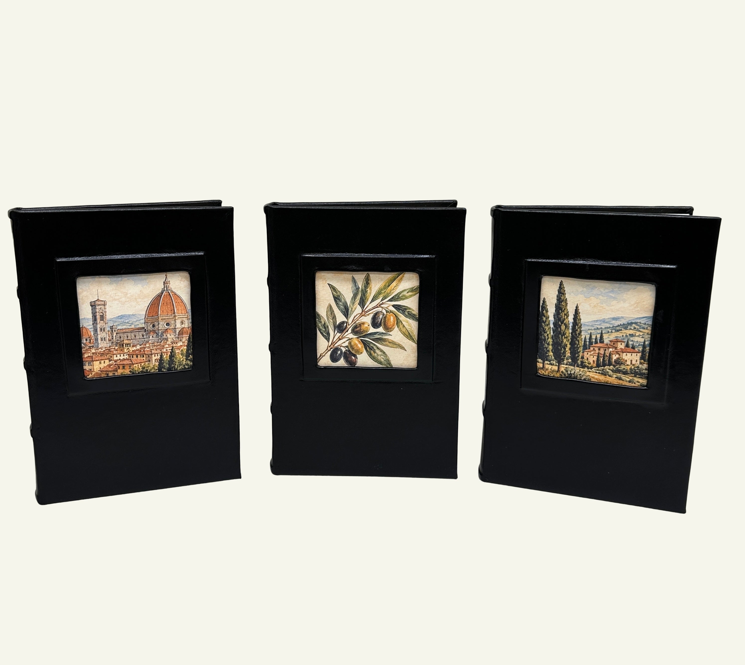 Three Black leather journals with portrait window featuring three designs; Florence Skyline, Italian Olive Branch and Tuscan Village
