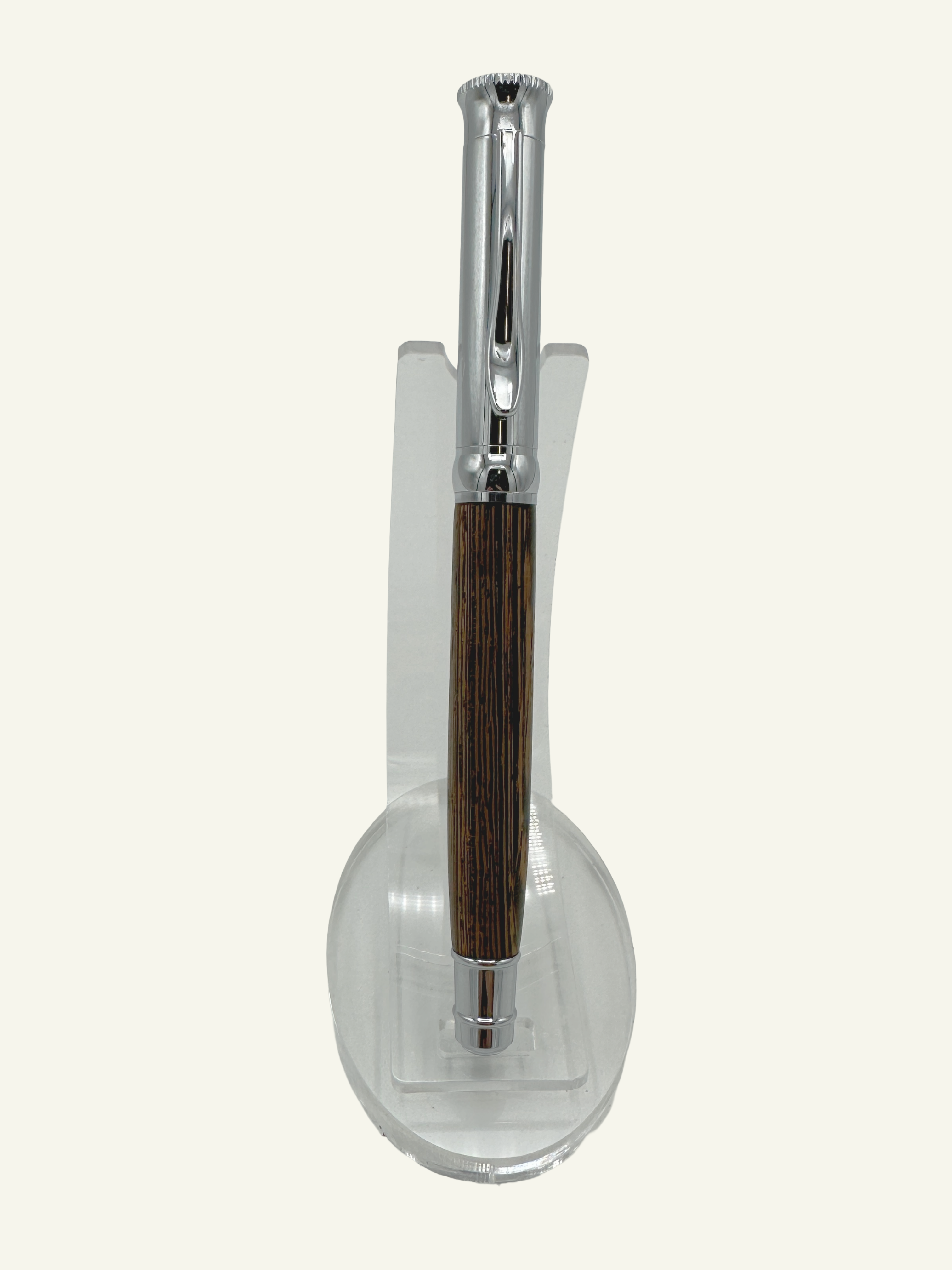 Elegant Italian rollerball pen standing on a display stand highlighting the genuine wood barrel and chrome cap.