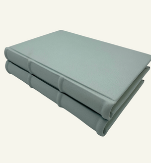 Handmade light blue leather journal with rounded spine detail 