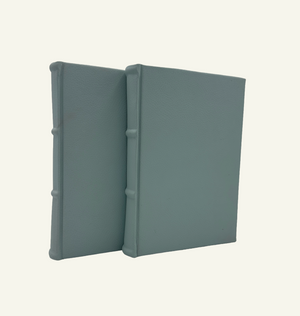 Handcrafted Italian light blue leather journals with rounded spine