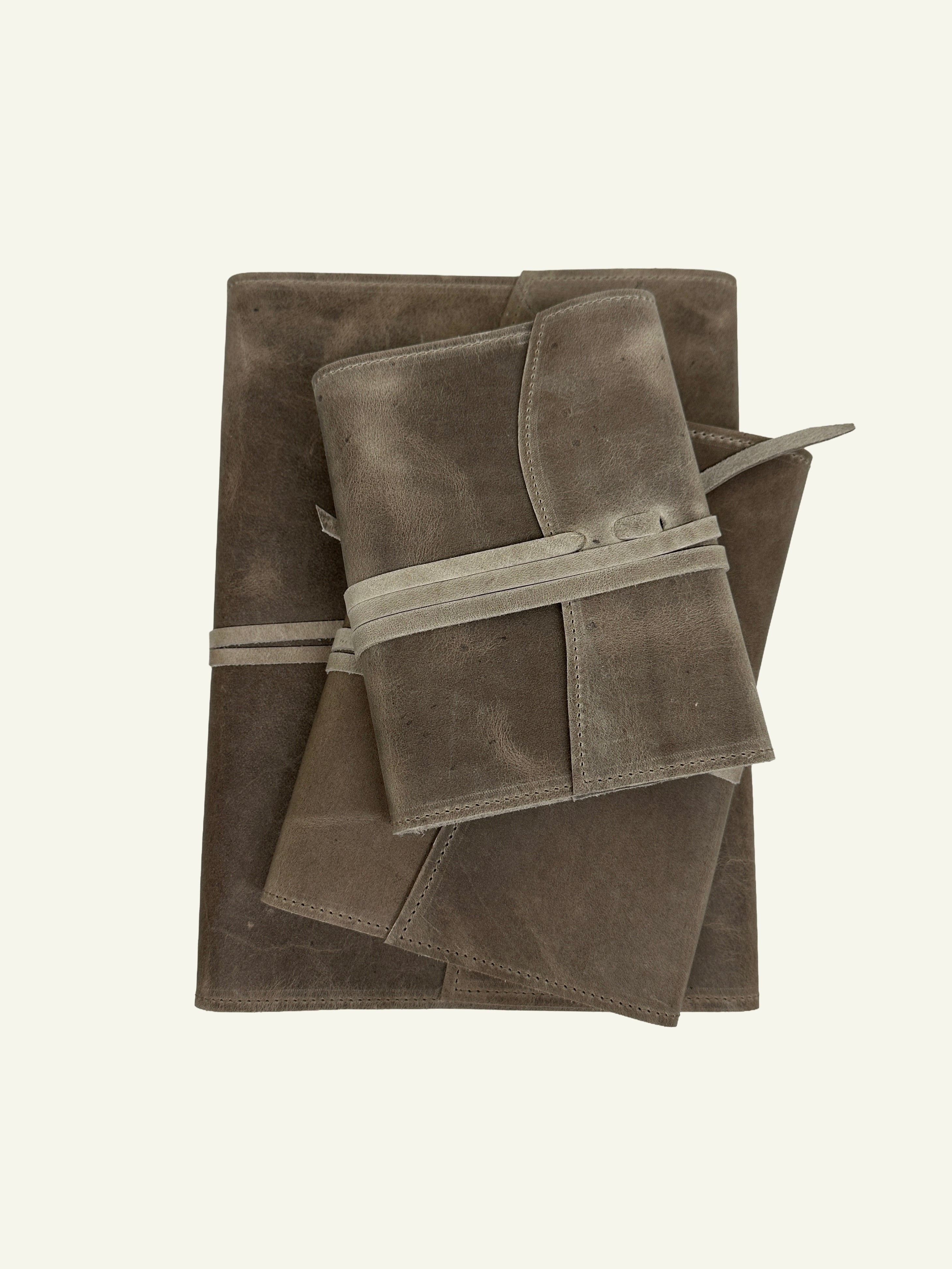 Stone taupe softcover refillable leather journal with two smaller journals resting on top