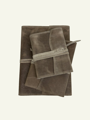 Stone taupe softcover refillable leather journal with two smaller journals resting on top