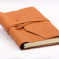 Epica's Refillable Handmade Leather Wrap Journal in camel